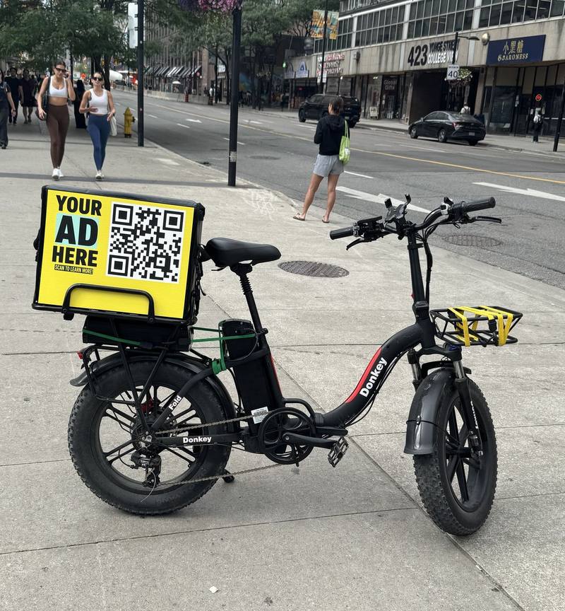 E-bike delivery bag with an advertising panel in downtown Toronto