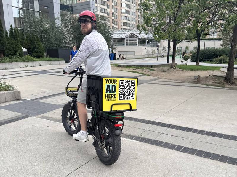 E-bike delivery bag with an advertising panel in downtown Toronto
