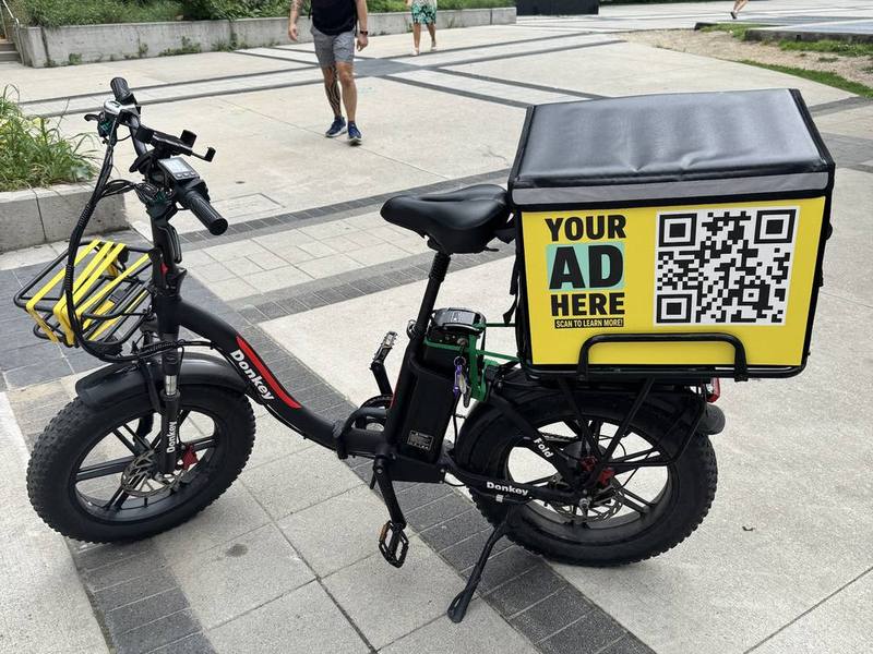 E-bike delivery bag with an advertising panel in downtown Toronto