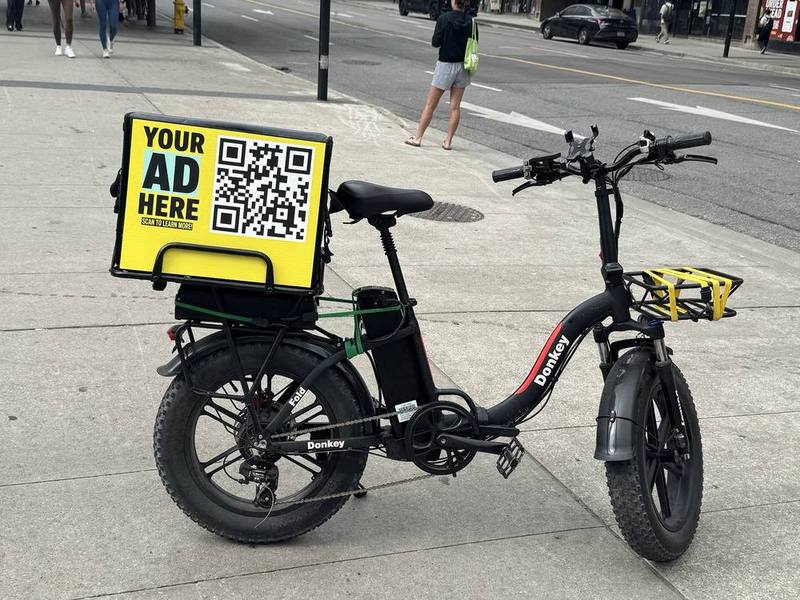 E-bike delivery bag with an advertising panel in downtown Toronto