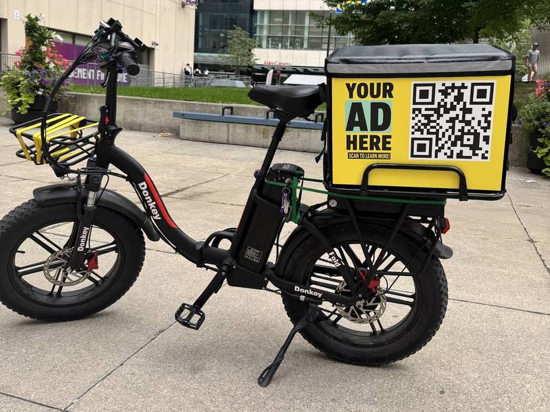E-bike delivery bag with an advertising panel in downtown Toronto