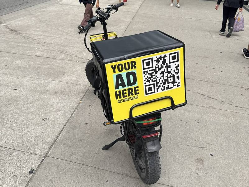 E-bike delivery bag with an advertising panel in downtown Toronto